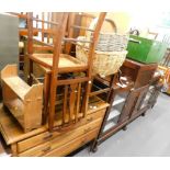 An oak dressing table, three bedroom chairs, book rack and two baskets.