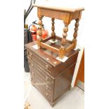 An oak stool and a hi-fi cabinet.