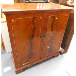 A mahogany two door cabinet, on bracket feet, 82cm wide.