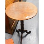 A Victorian mahogany tilt top occasional table, with plain circular top on bobbin turned supports te