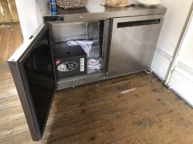 A stainless steel two door unit, incorporating a safe. To be sold upon instructions from Vine's Bake