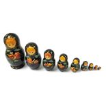 A Russian Babushuko doll, nine graduated with painted decoration, largest 24cm high.