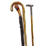 A carved rootwood walking stick, 87cm high, an early 20thC Anglo Indian walking cane, with a white m