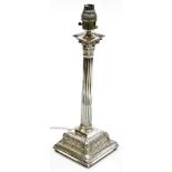 A George II silver Corinthian column candlestick, converted to electricity, on a loaded base, Samuel