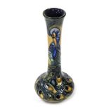 A Moorcroft Pottery vase decorated in the Phoenix pattern, of long necked form, designed by R J Bish