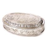 A 19thC Continental silver dressing table box and cover, the lid with embossed decoration of putti f