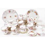 A mid 19thC Staffordshire porcelain part tea service, decorated with rose sprays, comprising bread p