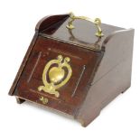A Victorian mahogany coal scuttle, with brass carrying handle and decorative motif to the lift up fr