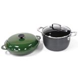 A Le Creuset green enamel paella pan and cover, together with a Tefal Jamie Oliver casserole dish an