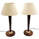 A pair of Scandinavian vintage mid-century oak table lamps, with oatmeal coloured shades, 59cm high.