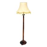 A Victorian stained oak standard lamp, with an oatmeal coloured shade, 187cm high.