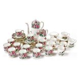 A Crown Staffordshire porcelain coffee service decorated with flowers, comprising coffee pot, covere