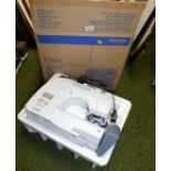 A Brother sewing machine, XL2220, with unassociated box.