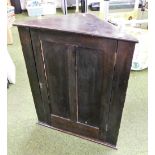 An oak hanging corner cabinet, 78cm high.