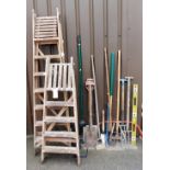 Two wooden A frame step ladders, various garden tools to include forks, spades, rake, shoe last, oth