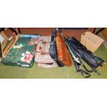 Various walking sticks, umbrellas, a chestnut leather briefcase, wicker basket, table linen, etc. (c