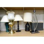 Five table lamps, one in the form of a brass oil lamp, 52cm high.