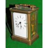 An early 20thC brass cased carriage clock, with Roman numeric Arabic dial and single barrel movement