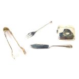 A George V silver match case, Birmingham 1943, bearing the initials JAC, a silver butter knife, a pa