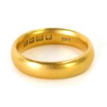 A 22ct gold wedding band, of plain design, Birmingham, size M ½, 8g.