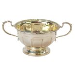 A silver bowl, with two handles and beaded rim, Birmingham c1920, 4oz.