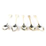 Five silver teaspoons, comprising a set of three George V silver teaspoons, fiddle pattern, Sheffiel