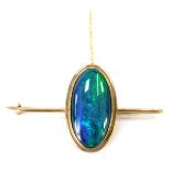 A 9ct gold opal set bar brooch, the oval opal in a rub over setting on single pin back with safety