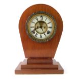 An Ansonia Clock Company mantel clock movement, in the Art Deco style with a shaped top, on three st