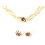 A cultured pearl jewellery suite, comprising two strand graduated necklace and earrings, the necklac