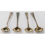 A set of four Victorian silver small ladles, with fiddle pattern top, bearing the crest and initial