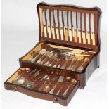 A mahogany cased twelve piece silver plated cutlery set, enclosing fiddle pattern EPNS spoons, bone