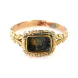 A Victorian Memorial ring, with vacant panel and scroll V shaped shoulders, yellow metal unmarked, s