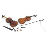 Two violins, each with two piece back , one bearing Vuillaume label and a bow. (AF)