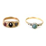 Two dress rings, comprising a 9ct gold and garnet set gypsy ring (one stone missing), size K, and a