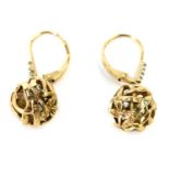 A pair of ball drop earrings, the interwoven ball design set with 3 point flower set with CZ set loo