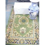 An Eastern blue vase, rug, and a boxed wall light. (3)