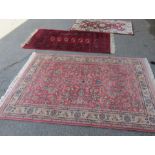 Three various Kashan design rugs.