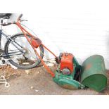 A Suffolk Colt push-a-long cylinder mower.