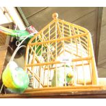 A parrot bird cage ornament, two parrots, and a wooden toadstool. (4)