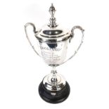 A 1930's Greyhound Racing Club trophy, The Bacci Cup, of campana form with acanthus leaf capped swan