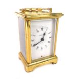A 20thC French brass carriage clock, with swing handle and bracket feet, 5cm back plate with Roman n