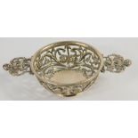 A Victorian silver miniature quaich, by William Comyns, with pierced border and handles, on circular