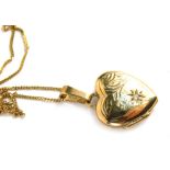 A 9ct gold heart shaped locket, 1cm high, attached to a slender link necklace, 1.9g all in.