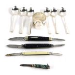 Three raised penknives, a silver napkin ring of plain form, and a cased set of plated teaspoons, the