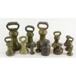 A quantity of late 19th/early 20thC brass bell shaped weights, various designs, sizes, makers, etc.