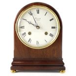 A Comitti London mahogany cased mantel clock, the domed case holding a 13cm diameter Roman numeric d