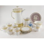 A collection of Wedgwood Gold Marguerite pattern ceramics, some boxed.