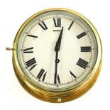A 20thC brass bulkhead clock, of circular form, with 19cm diameter Roman numeric and Arabic dial, i