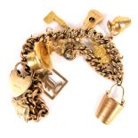 A 9ct gold charm bracelet, with S links and heart shaped clasp, with a number of various charms to i