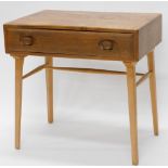 An Ercol elm small side table, with single drawer, with carved handles on square tapering legs, 68cm